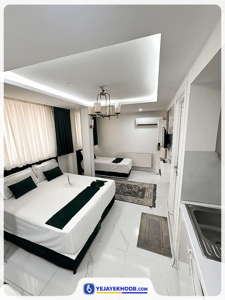 هتل آپارتمان پنجتن مشهد - اتاق 3 تخته (1 تخت 1 نفره و 1 تخت 2 نفره)