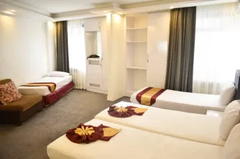 هتل-خورشید-مشهد - اتاق ۴ تخته (۴ تخت ۱ نفره)   